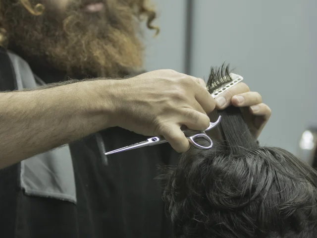 Haircutting tool in use at a barbershop
