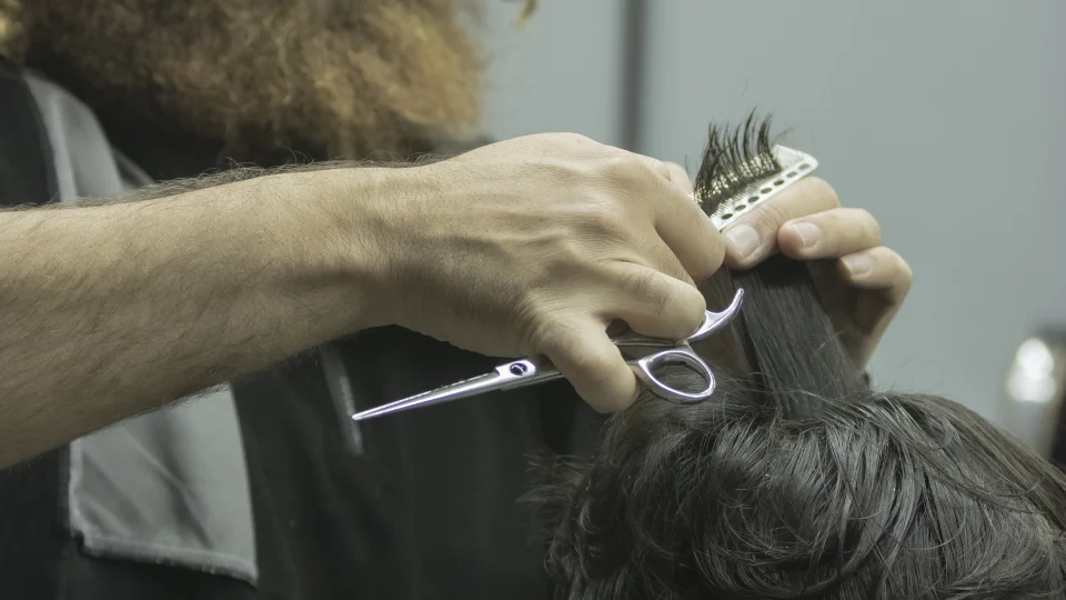 Haircutting tool in use at a barbershop