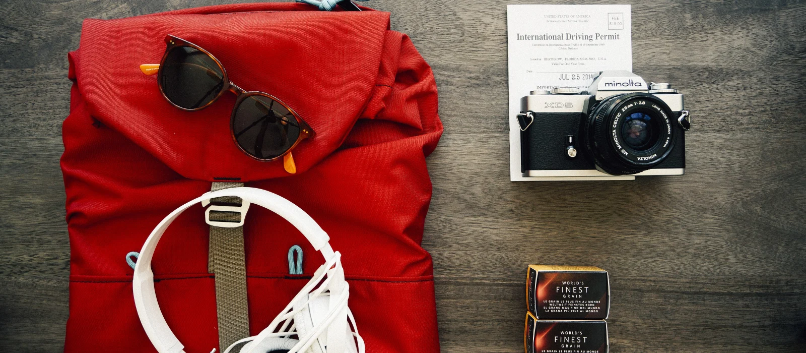 Travel backpack flat lay with accessories