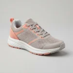 A single lightweight grey and coral running shoe on a plain studio background