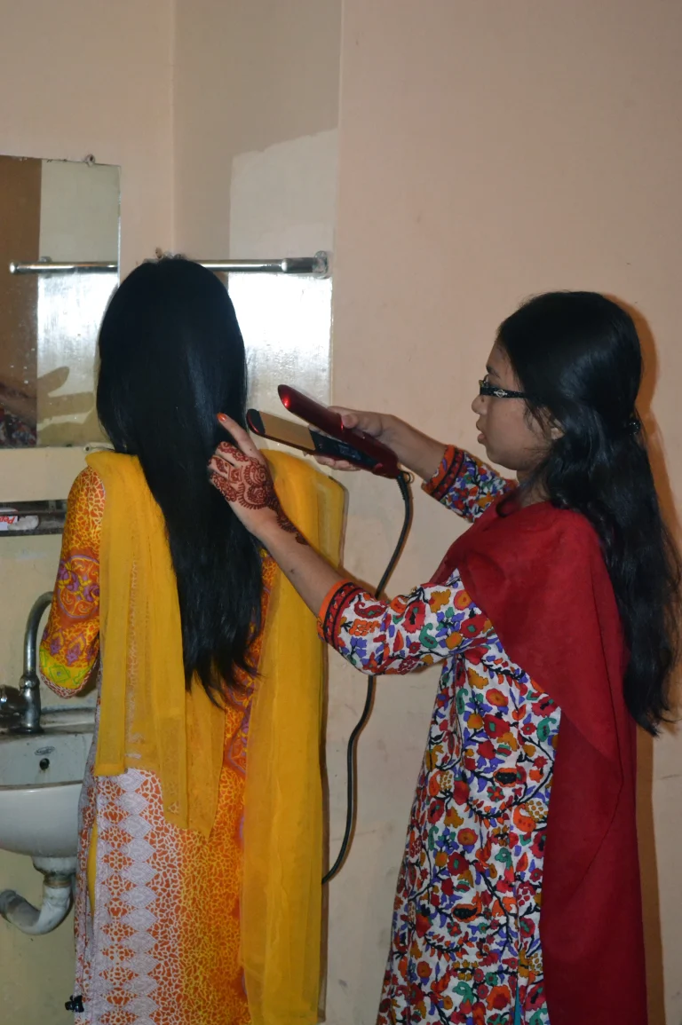 Hair straightening tool in use