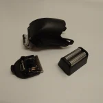 Disassembled electric shaver head, representative editorial image
