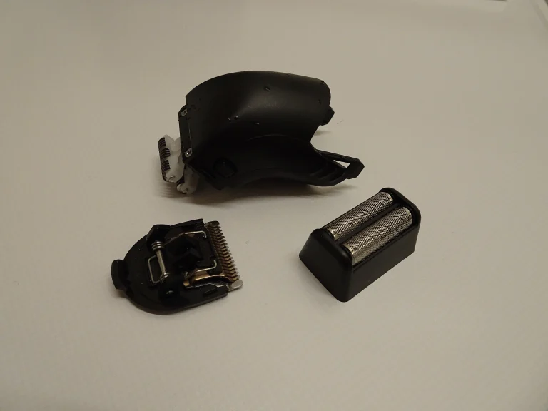 Disassembled electric shaver head, representative editorial image