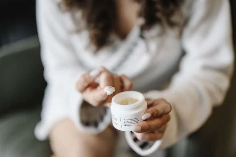 Skincare cream application, representative editorial image