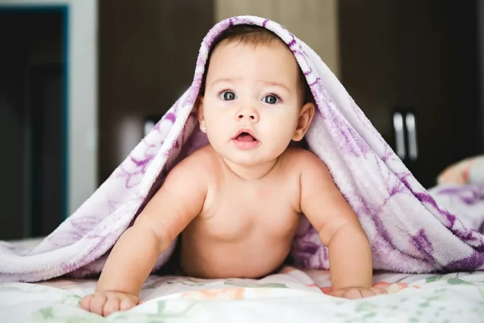 Baby wrapped in a soft blanket, representing baby soap deals