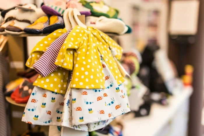 Colourful kids clothes on a rack