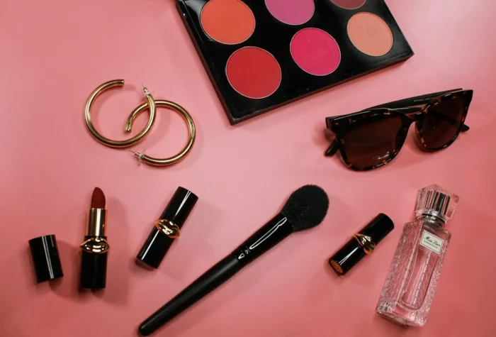 Lipsticks, a blush palette and a makeup brush